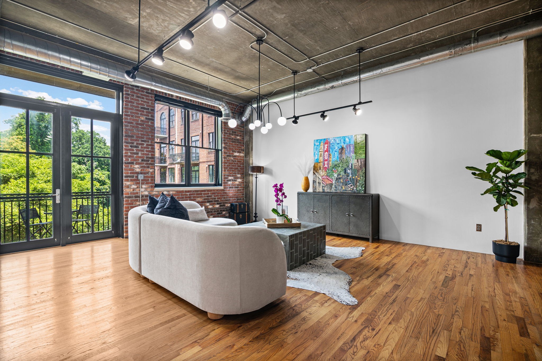 Living area and windows at Buckhead Village Lofts Unit 620